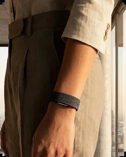 Hume Band 2.0 worn on the wrist beneath a linen sleeve — metabolic capacity tracking during everyday life