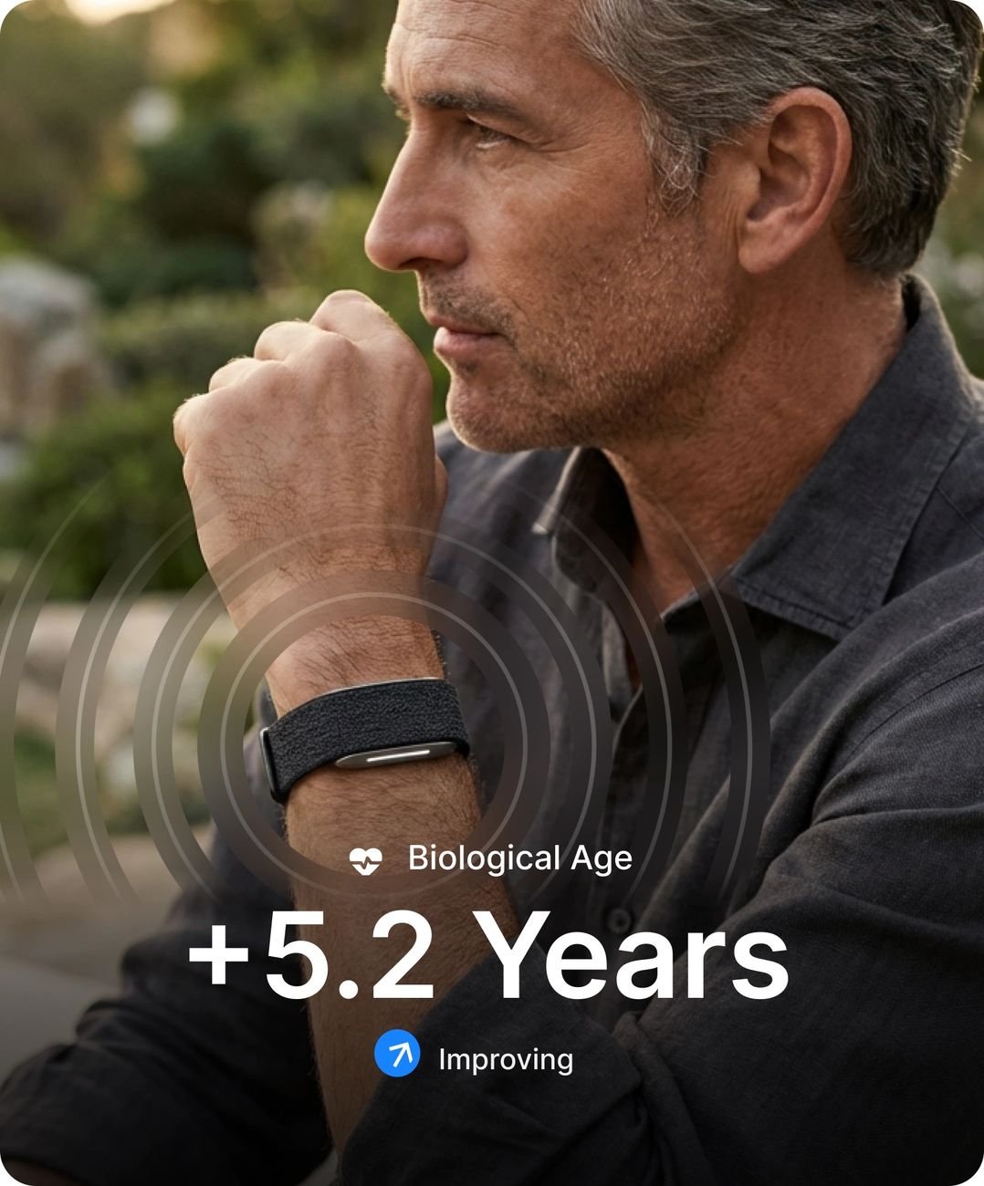 Man wearing Hume Band with biological age and chronic illness risk shown in app
