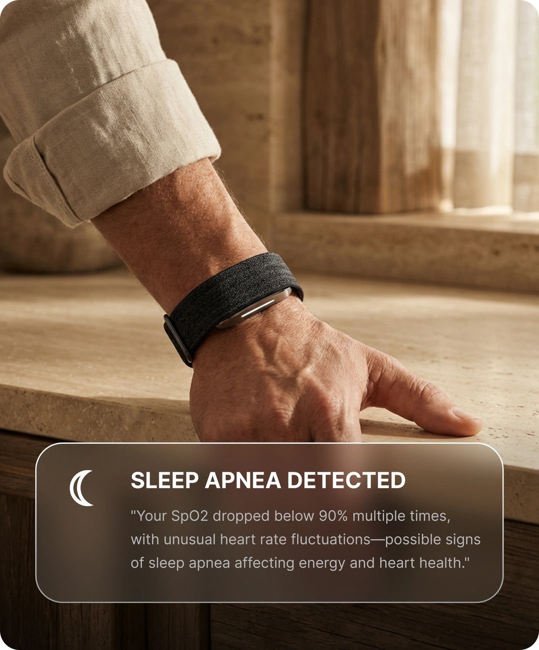 Hume Band on wrist with a sleep apnea alert shown in the companion app